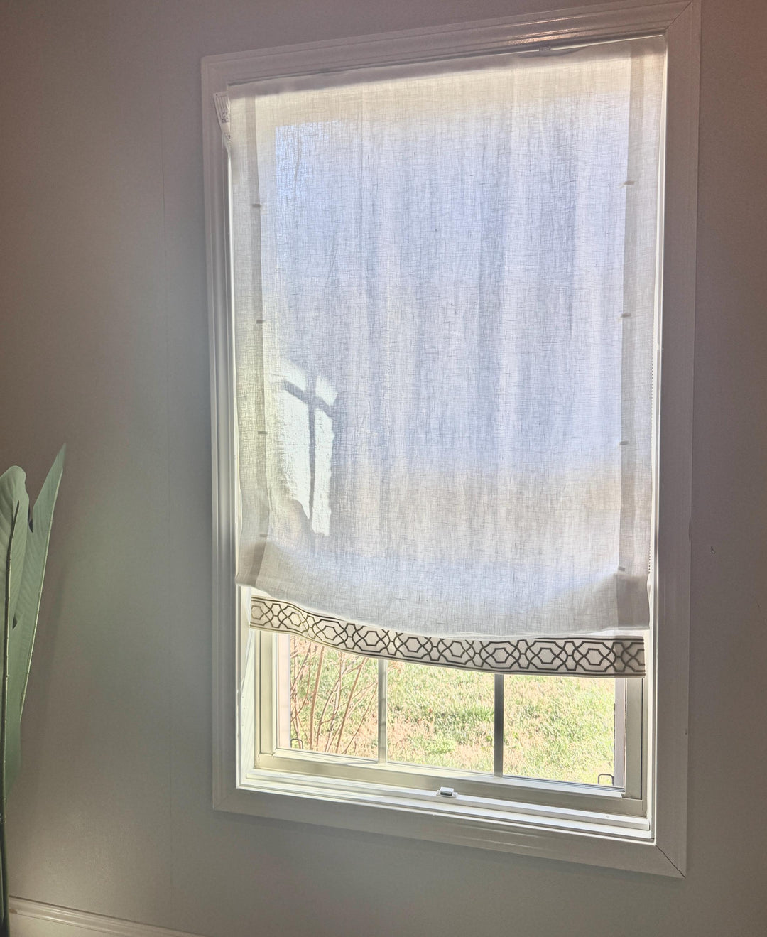 Relaxed White Linen Roman Shade with Decorative Trim, Ribbon Edge Blind