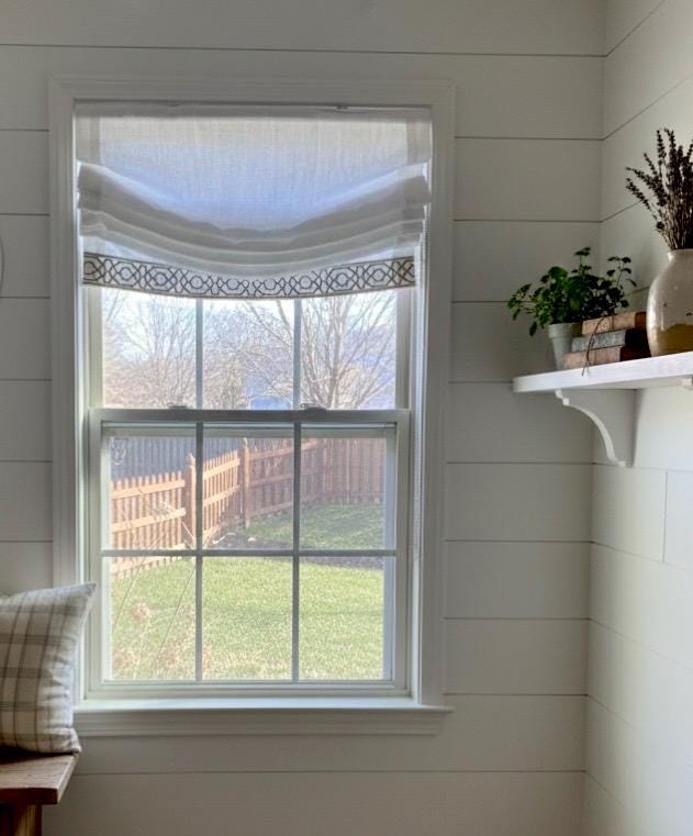Relaxed White Linen Roman Shade with Decorative Trim, Ribbon Edge Blind
