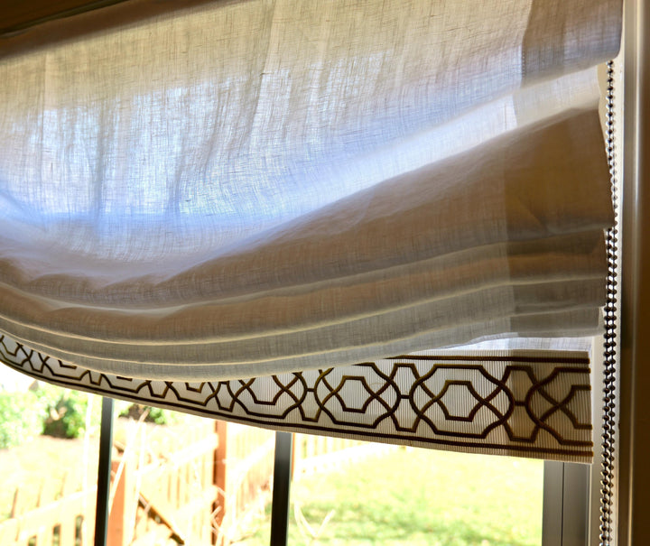 Relaxed White Linen Roman Shade with Decorative Trim, Ribbon Edge Blind
